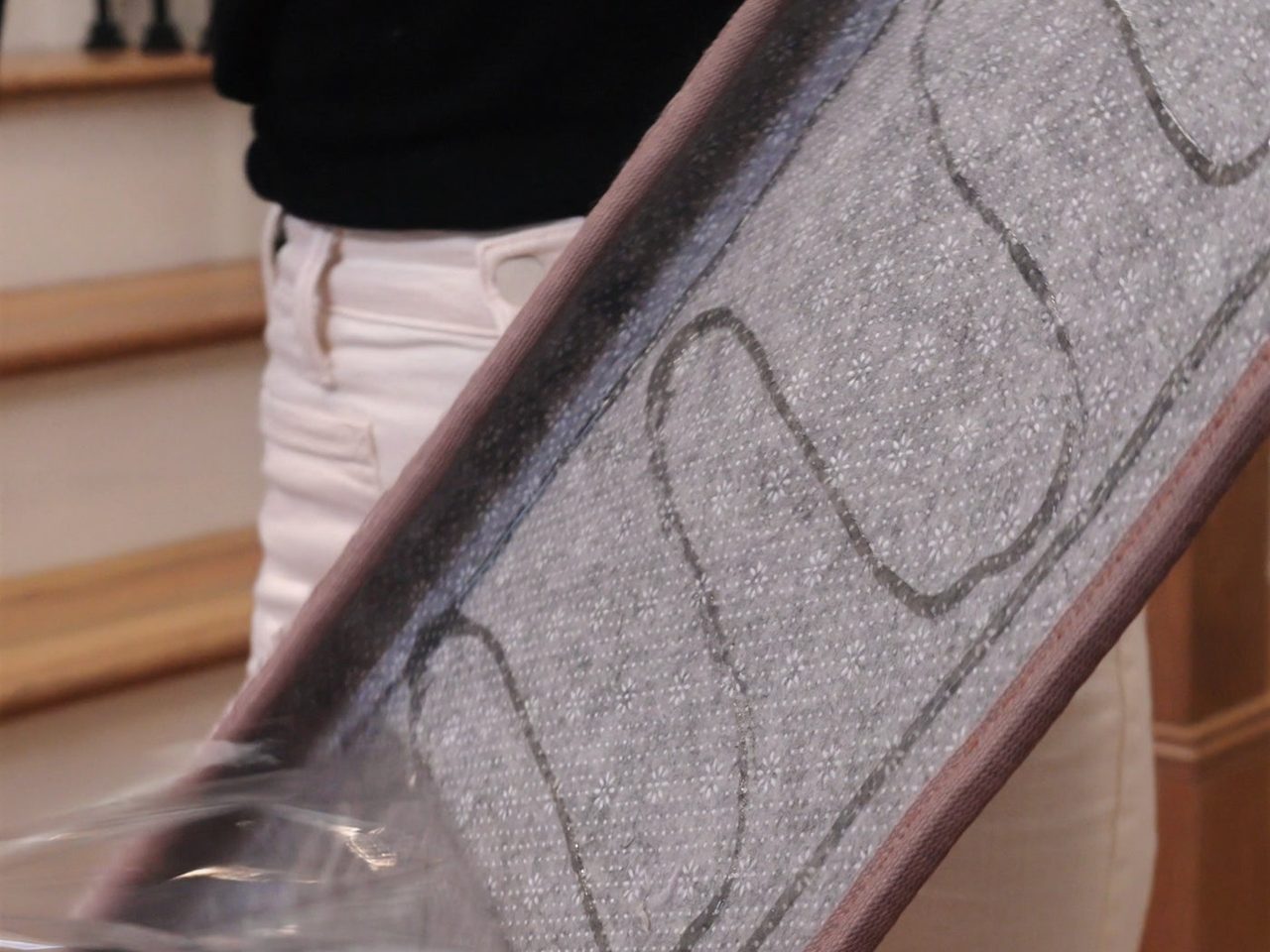 Positioning a stair tread on a wooden step
